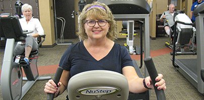 woman on exercise machine